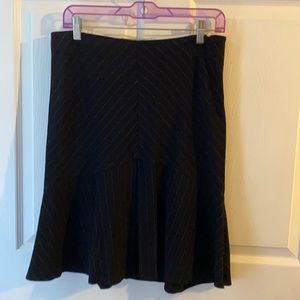 Necessary objects black skirt with pinstripe design.